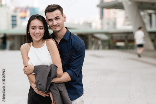 Happy young  interracial couple.