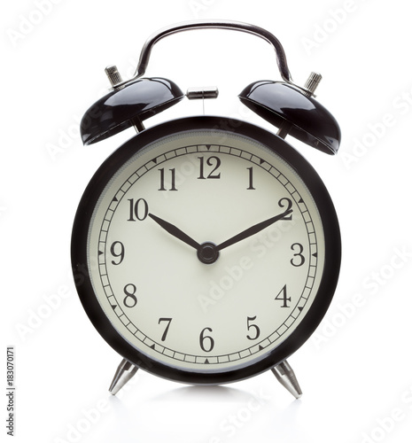 Old-fashioned alarm clock isolated on white background