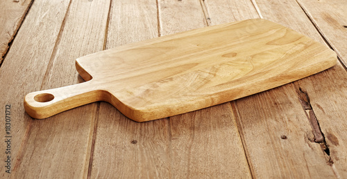 Wood cutting board on wooden background