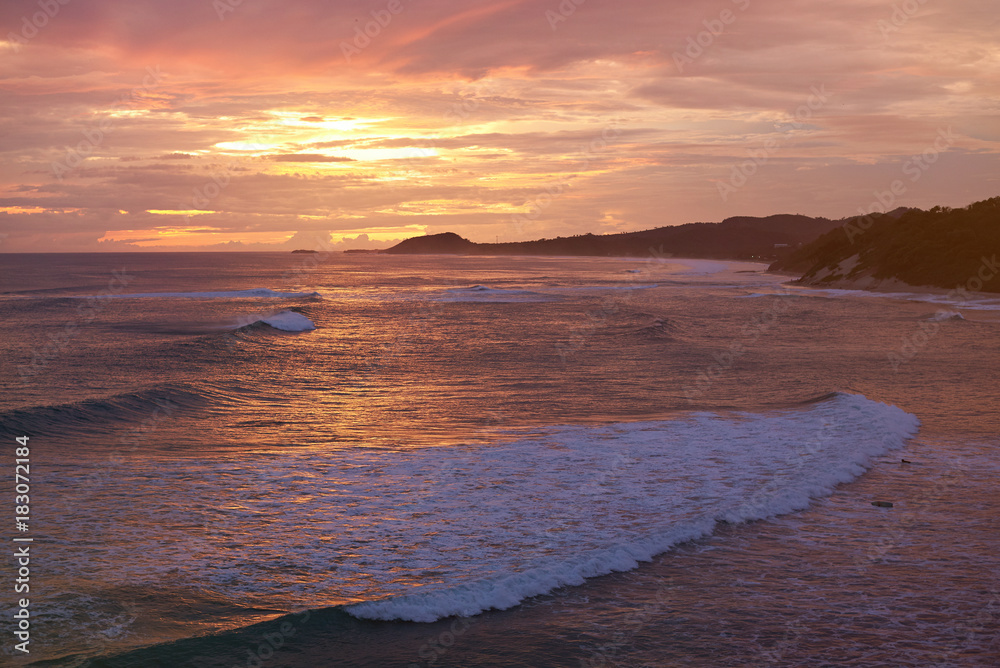 Colorful sunset on ocean coastline