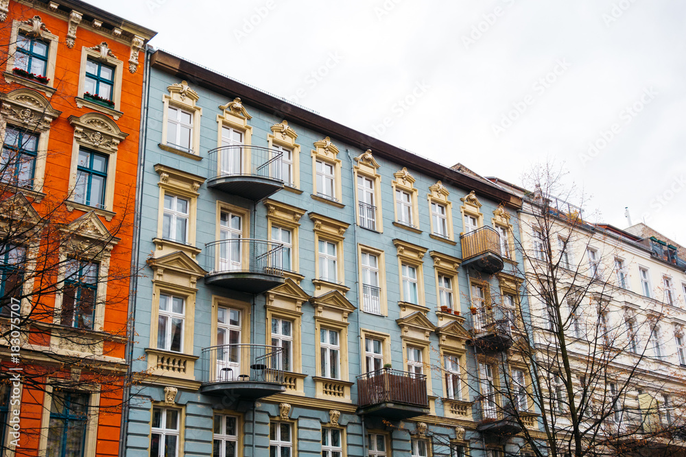 Row of colorful tenement buildings