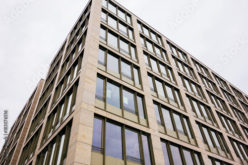 low angle view of modern marble colored office building