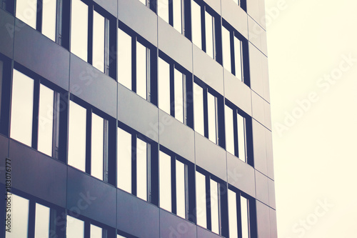 black facaded office building with mirroring windows