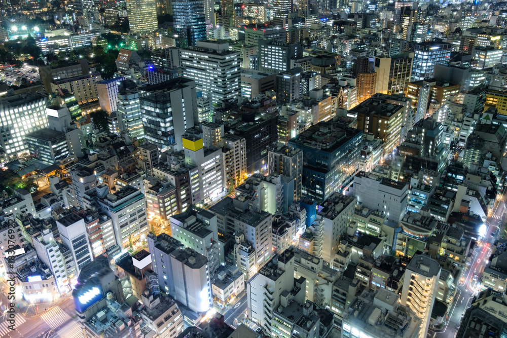 Aerial view of downtown crowded with glowing light at tokyo