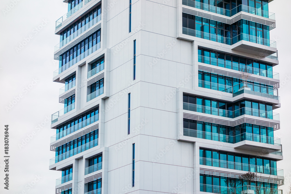 detailed view of white skyscraper with blue windows detailed view of white skyscraper with blue windows