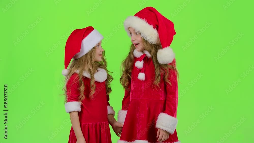 Two children are talking about the celebration of the new year. Green screen. Slow motion Two children are talking about the celebration of the new year. Green screen. Slow motion