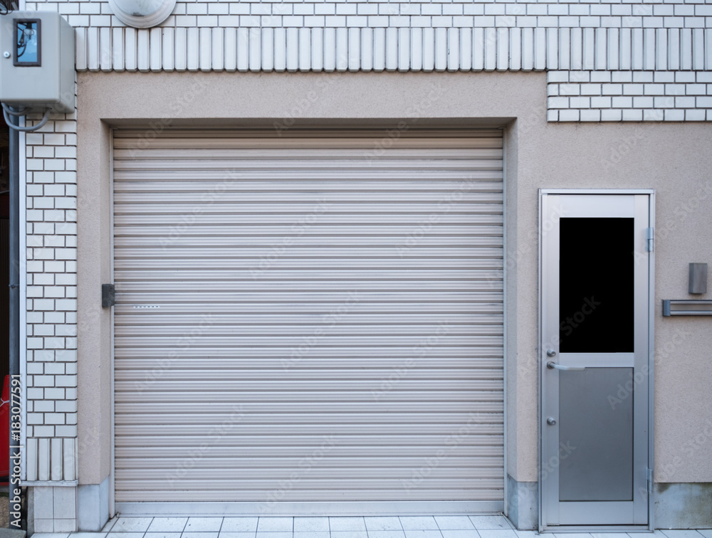 Fototapeta premium Garage with door residence on white brick