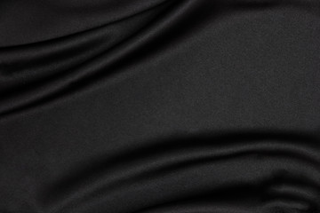 Black fabric texture background. Smooth elegant black silk can use as wedding background.