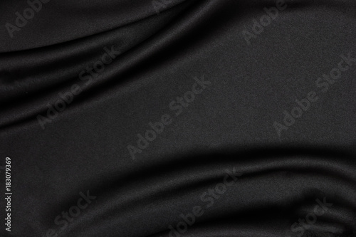 Black fabric texture background. Smooth elegant black silk can use as wedding background.