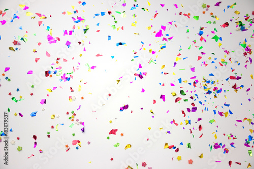 colourful sparlking confetti on white background