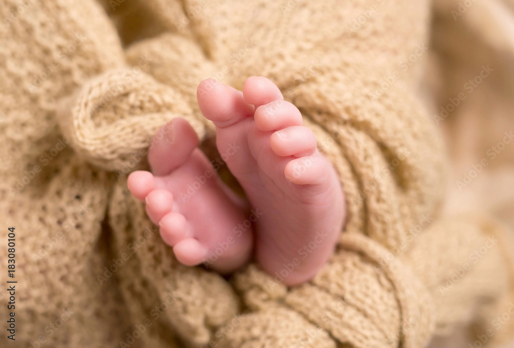 Tiny little toes of infant sleeping wrapped up in blanket Tiny little toes of infant sleeping wrapped up in blanket
