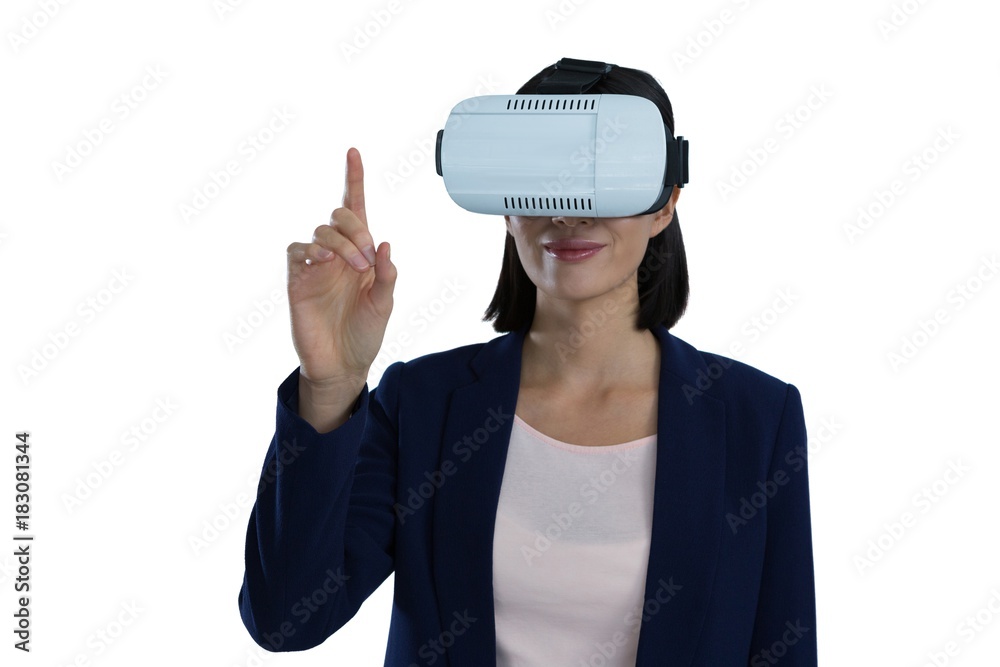 Businesswoman gesturing while using virtual reality headset Businesswoman gesturing while using virtual reality headset