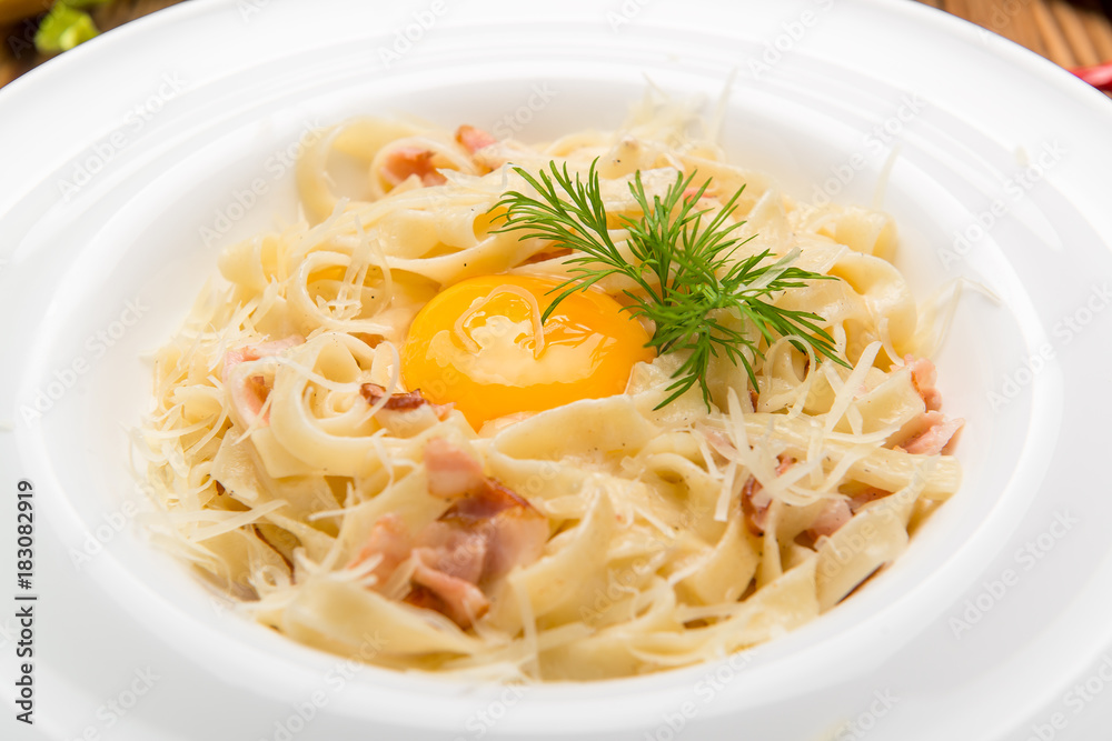 Spaghetti alla carbonara. beautiful and tasty food on a plate Spaghetti alla carbonara. beautiful and tasty food on a plate
