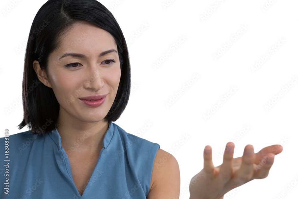 Female executive pretending to hold invisible object Female executive pretending to hold invisible object