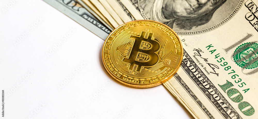 A symbolic coins of bitcoin on banknotes of one hundred dollars exchange bitcoin cash for a dollar