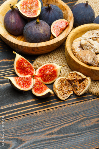 Fresh and dried Fig isolated on wooden background