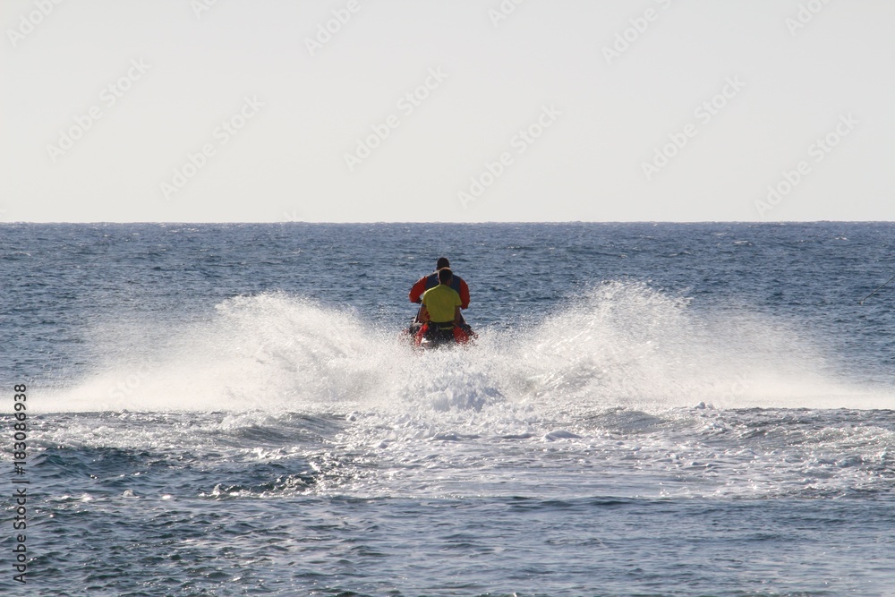 Fast ride on a jet ski towards the open sea