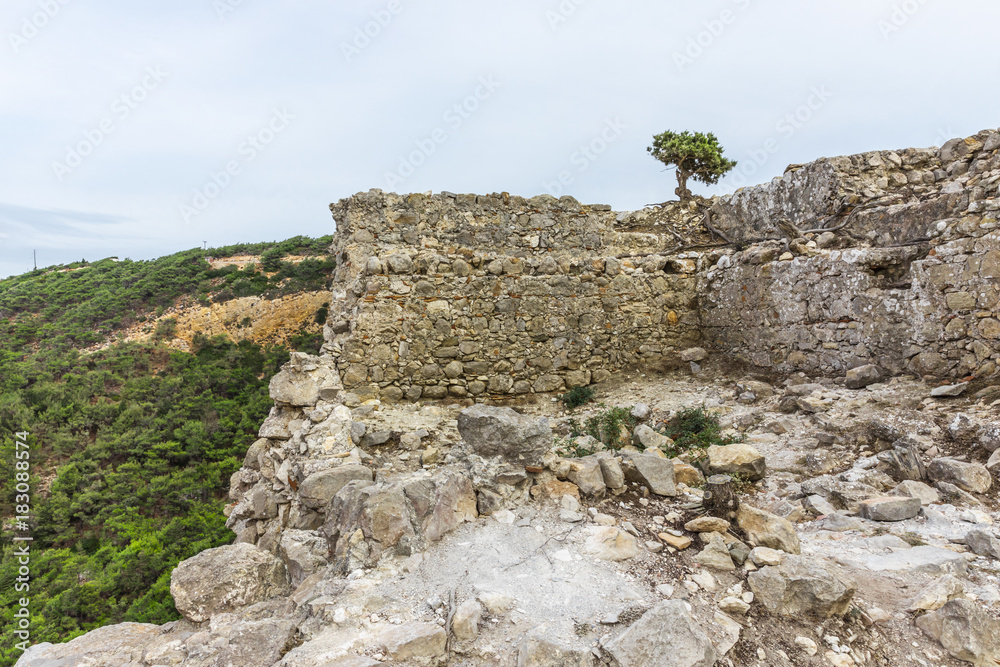 The Castle of Monolithos in Rhodes, Greece. It is today ruined but offers great views to the beach of Fourni and the two small islets. 
