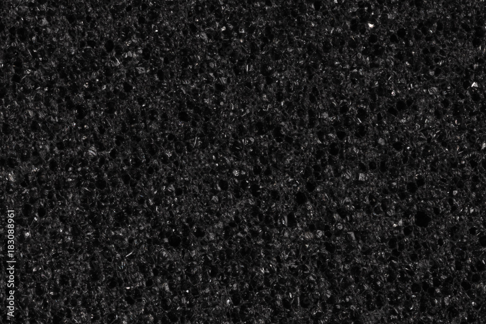 Fototapeta premium Contrast porous foam (EVA) texture in dark colour.