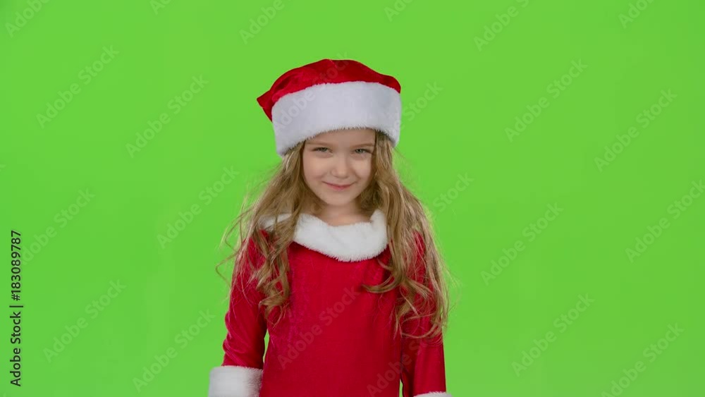 Kid in a red suit are standing in the room and wink. Green screen. Slow motion Kid in a red suit are standing in the room and wink. Green screen. Slow motion