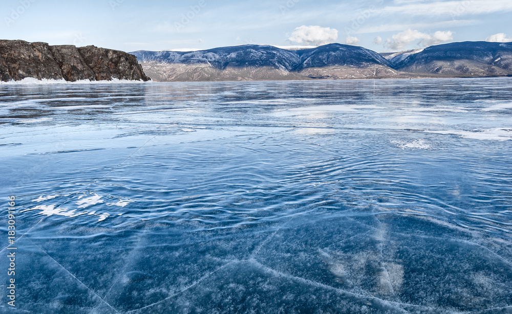 frozen waves on the ice of lake Baikalм