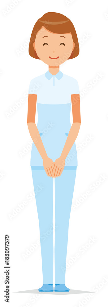 A female nurse wearing a white uniform standing with a smile A female nurse wearing a white uniform standing with a smile