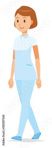 A female nurse wearing a white uniform is walking