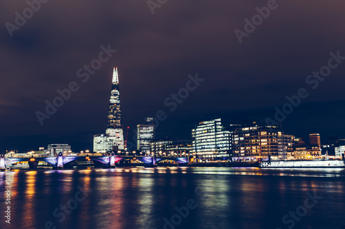 Long exposure shot of modern London cityscape skyline with shard building at night