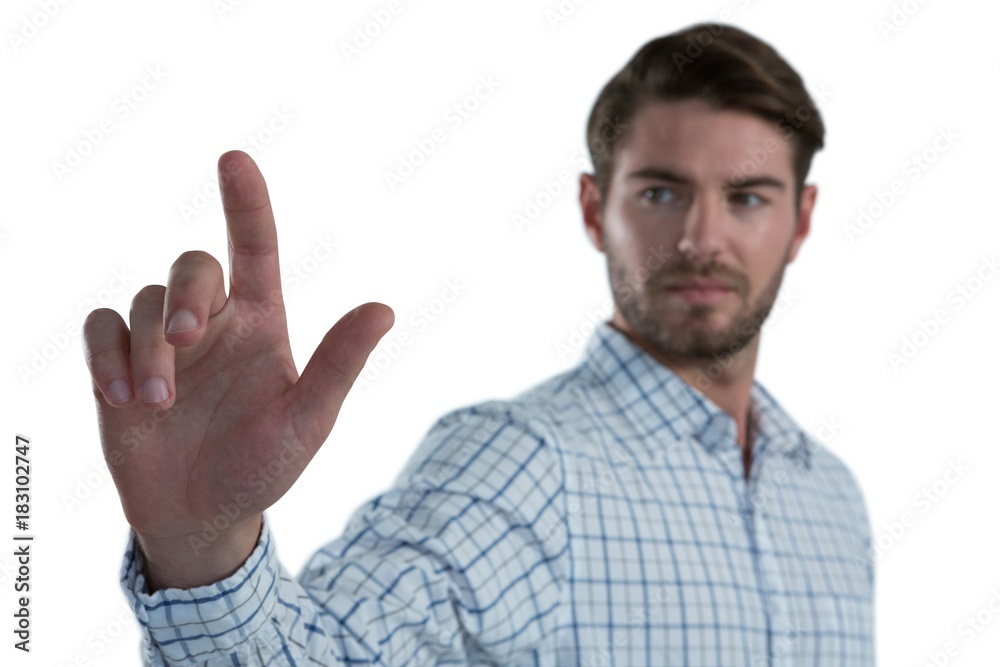 Man pretending to touch an invisible screen Man pretending to touch an invisible screen