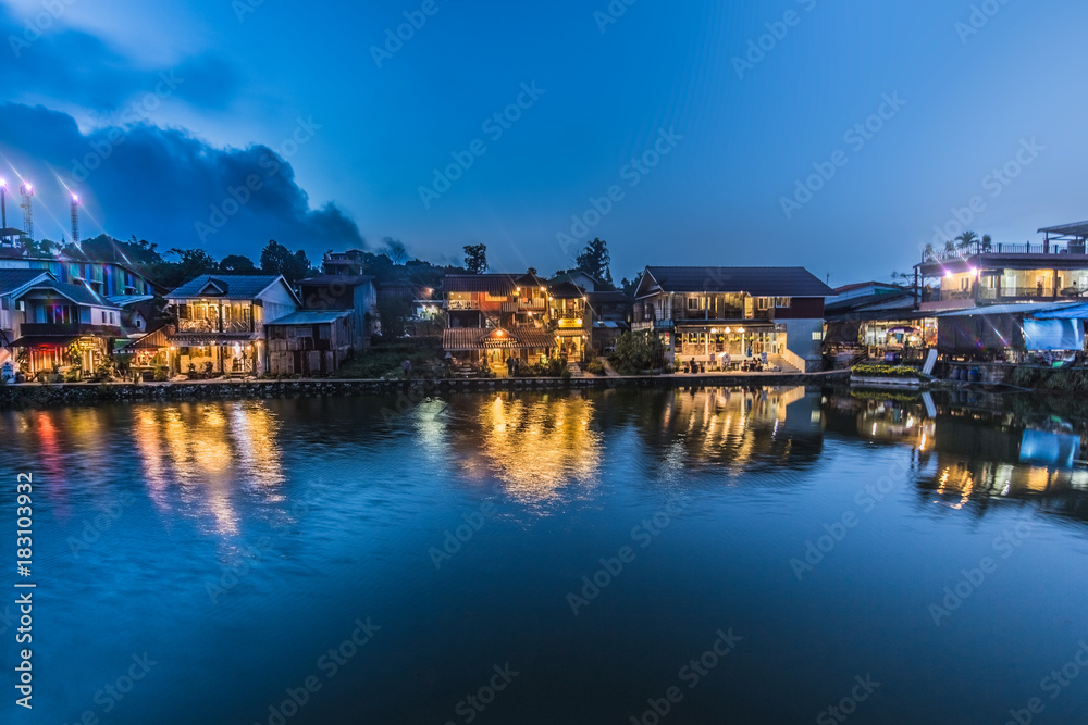 scenery view. beautiful waterfront village in night scene have light from house