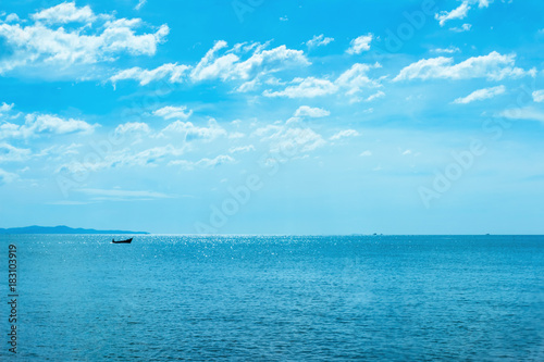 The sea and blue sky are reflected in the sunlight in the water. © tapui