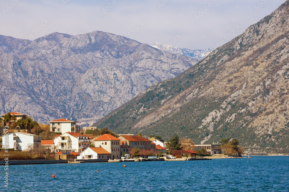 Small town at the foot of the mountains. Bay of Kotor, Prcanj, Montenegro