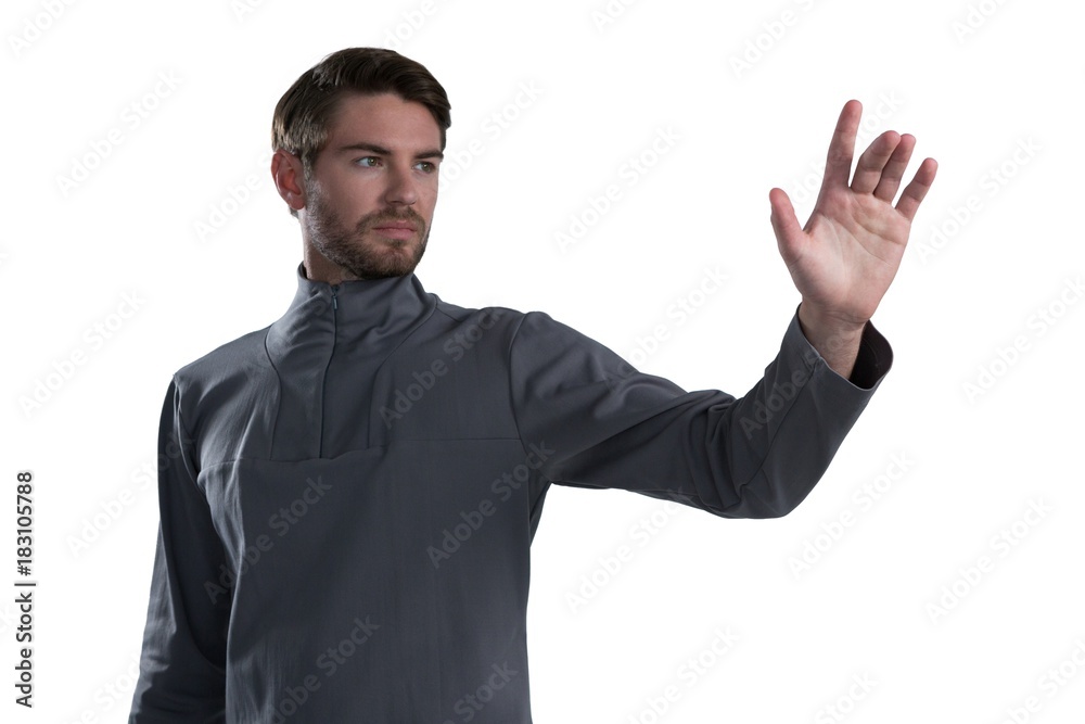 Man pretending to touch an invisible screen Man pretending to touch an invisible screen
