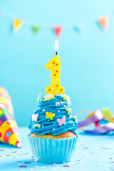 First 1st birthday cupcake with candle and sprinkles. Card mockup.
