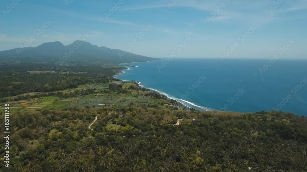 Aerial view sea coast, ocean, mountains, sea, beach, sky, clouds. Bali, Indonesia. Seascape with Seashore on the background of mountains Aerial footage Aerial view sea coast, ocean, mountains, sea, beach, sky, clouds. Bali, Indonesia. Seascape with Seashore on the background of mountains Aerial footage