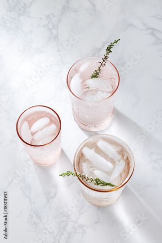 Three festive drinks on a white marble surface 