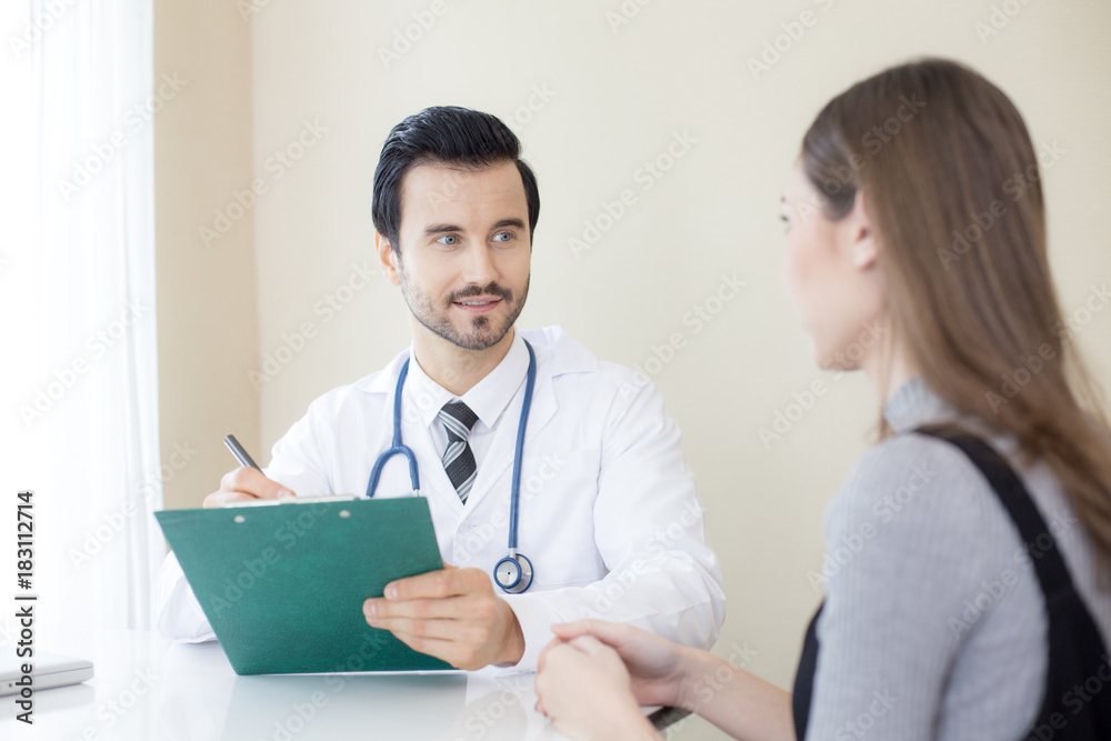 Portrait of Doctor working at hospital. Woman try to explan about her problem to doctor. People with medical concept. Portrait of Doctor working at hospital. Woman try to explan about her problem to doctor. People with medical concept.