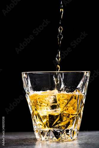 Whisky poured in glass