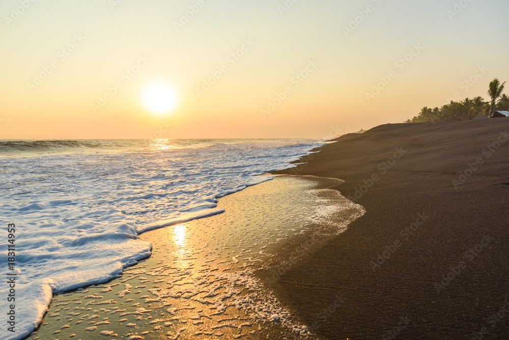 Sunset at Beach with Black Sand in Monterrico, Pacific coast of Guatemala. 