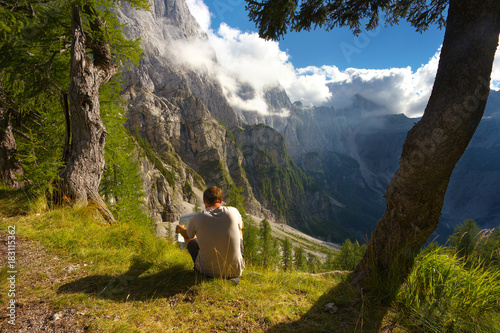 Man studying a map in the mountain landscape, Triglav National Park, Slovenia