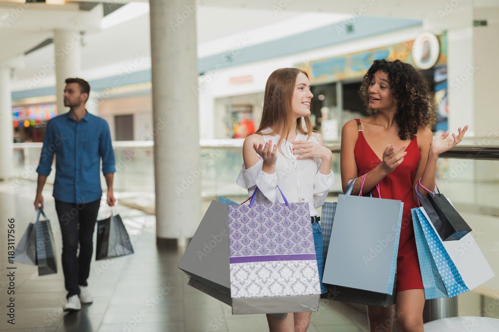 Girls are shopping at the mall. Sale in black Friday. Girls are shopping on a black Friday. Girls are shopping at the mall. Sale in black Friday. Girls are shopping on a black Friday.