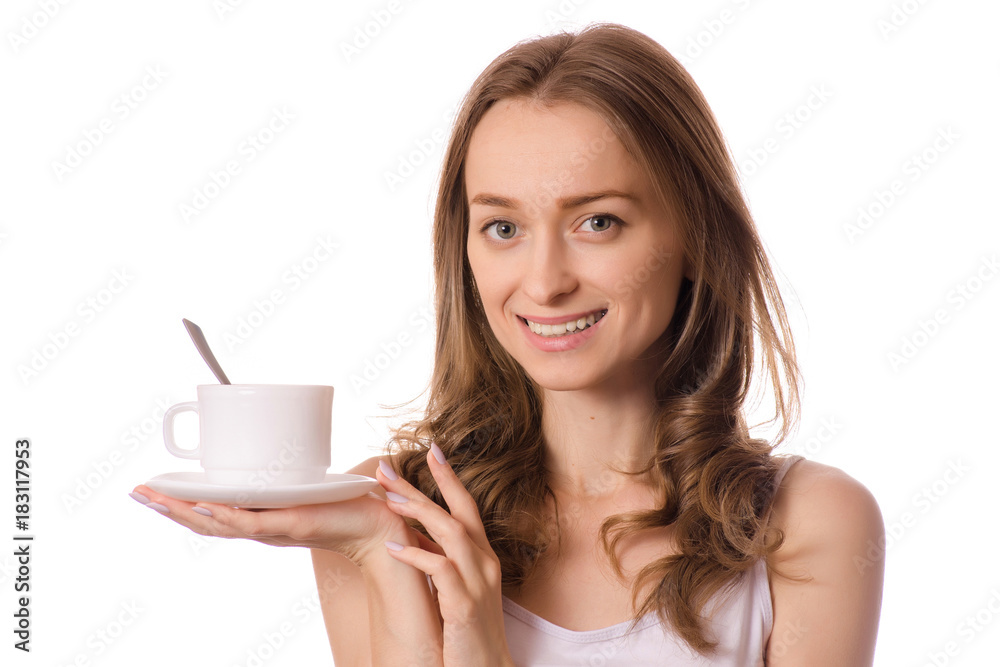 Beautiful young woman holding a white cup and saucer with coffee tea Beautiful young woman holding a white cup and saucer with coffee tea