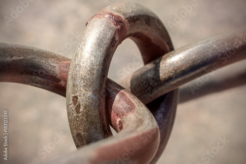 Links of a metal chain with rust spots photo