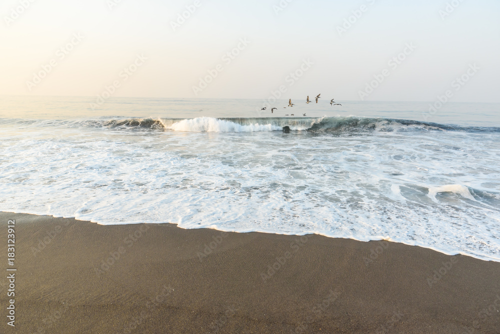 Sunset at Beach with Black Sand in Monterrico, Guatemala. Monterrico is situated on the Pacific coast. Known for its volcanic black sand beaches and annual influx of sea turtles. Sunset at Beach with Black Sand in Monterrico, Guatemala. Monterrico is situated on the Pacific coast. Known for its volcanic black sand beaches and annual influx of sea turtles.