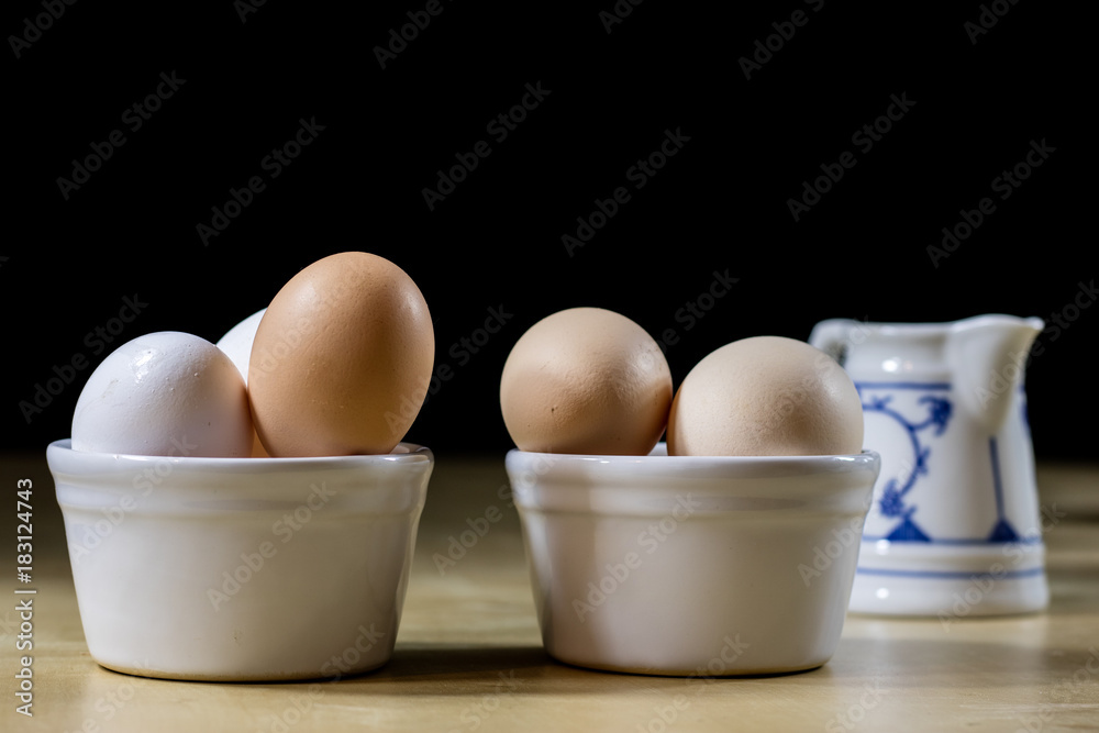 Egg, milk and jug on the kitchen table. Kitchen table with food products. Egg, milk and jug on the kitchen table. Kitchen table with food products.