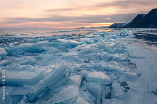 Sunset on frozen Baikal lake. Siberia.