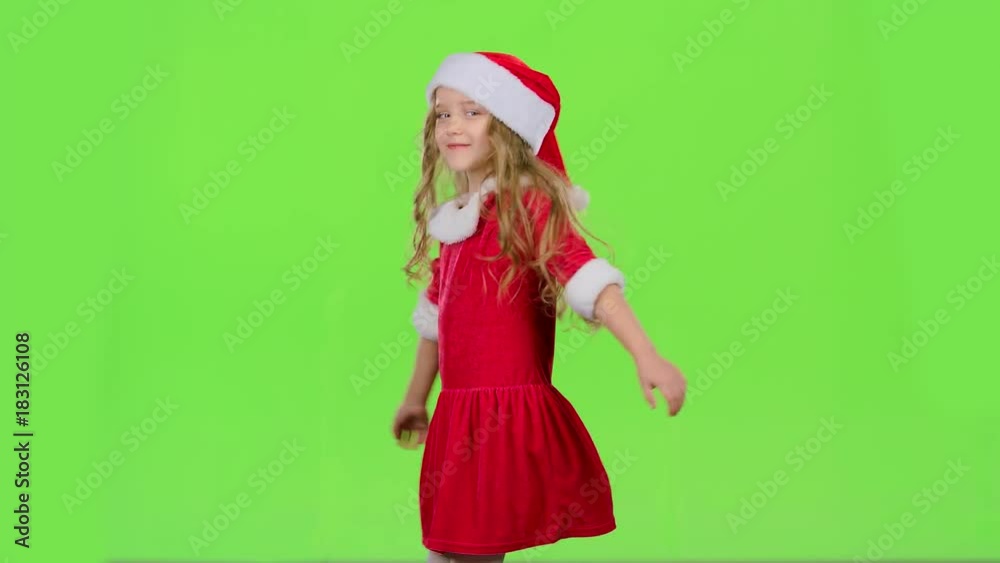 Child girl is spinning in her New Year's costume. Green screen Child girl is spinning in her New Year's costume. Green screen