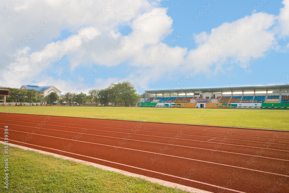 Obraz premium running track in stadium on blue sky for athletics and competition in university