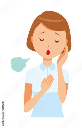 A female nurse wearing a white uniform is sighing