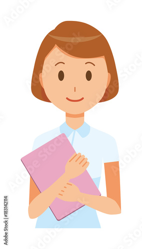 A female nurse wearing a white uniform standing with a file